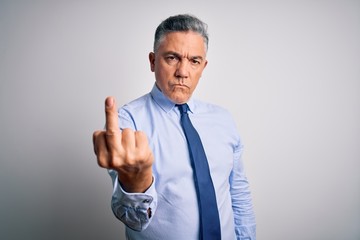 Middle age handsome grey-haired business man wearing elegant shirt and tie Showing middle finger, impolite and rude fuck off expression