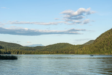 beautiful day at paul lake with blue sky and white clouds british columbia canada.