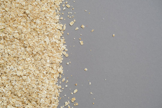 Fine grain oatmeal close up on grey background.Concept of healthy eating.