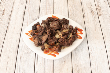 chicken liver dish on wooden table