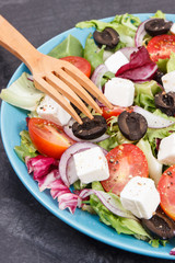 Greek salad with feta cheese and vegetables. Healthy lifestyles, food and nutrition concept