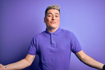 Young handsome modern man wearing casual purple t-shirt over isolated background clueless and...