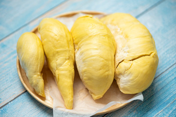 Durian fruit fresh from tree peel on wooden plate - Ripe durian tropical fruit summer for sweet dessert or snack in Thailand