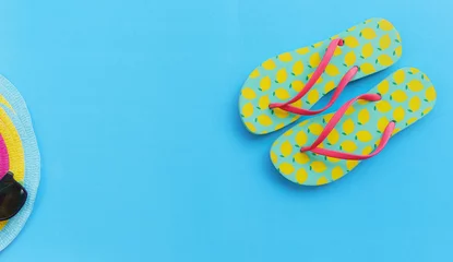 Türaufkleber Travel background concept / items summer travel accessories with flip flops for Traveler's on blue background © Bigc Studio