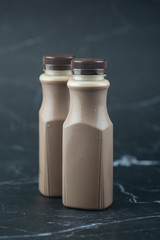 Tasty fresh milk chocolate in plastic bottle