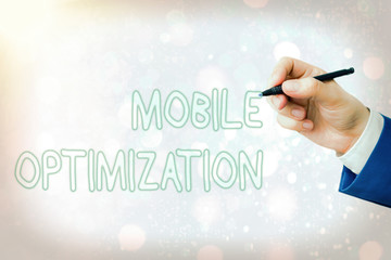 Conceptual hand writing showing Mobile Optimization. Concept meaning Site Content Reformatted for...
