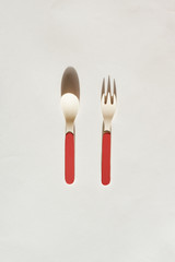 Close up of fork and spoon in sustainable bamboo on white background.