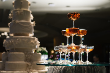 small tower of champagne's glass in wedding reception party