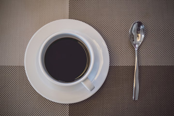 a cup of coffee ready on the table in breakfast time for wake up and refreshing your morning before business working time
