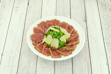 plate of beef tataki with cheese