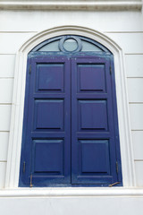 Large wooden window doors, neoclassical architecture.