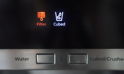 Refrigerator water filter indicator light on.