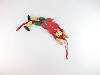 puppet Old wood Green and red puppet dolls On a white background.