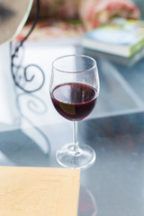 Glass of red wine on table close up, top view. Alcohol and drinks concept.