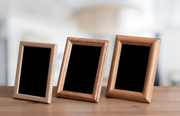 photo frames on the wooden table
