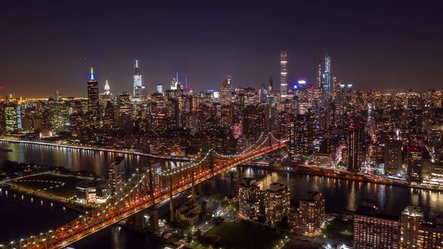 New York City above East river showing Manhattan by night aerial hyperlapse