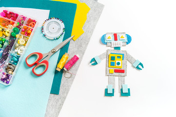 Craft from felt. Futuristic robot. A toy for a child.