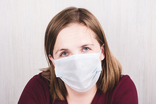 Woman Wearing Protection Medical Surgical  Face Mask Against Coronavirus. Сoronavirus Preventive Gear