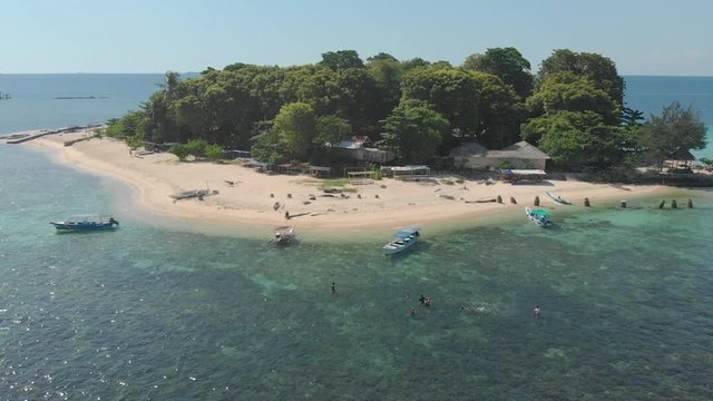 Aerial descending on the beach of Samalona Island and its clear water, Makassar, Indonesia