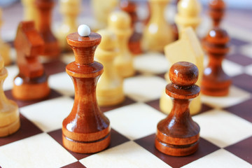 Chess queen on a chessboard