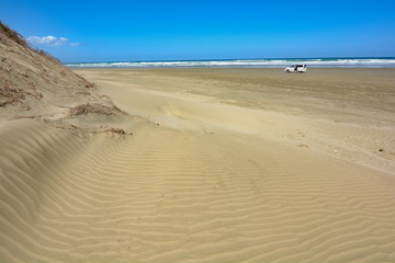Car on 90 Mile Beach, New Zealand