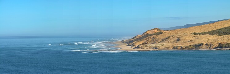 Panorama of sand dunes and waves, New Zealand