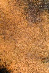 rusty metal background close-up. Red, yellow, orange, and black. black holes from rust. Old texture and background