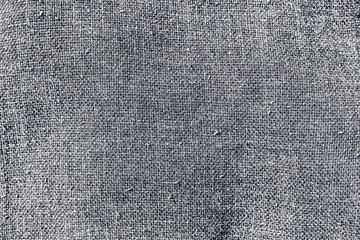 background of natural textured fabric in black, white and gray colors. Cotton and linen texture