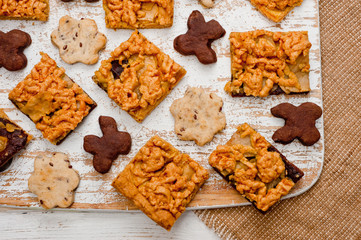 Homemade shortbread cookies lying on a white painted wooden surface. Baking and cooking.