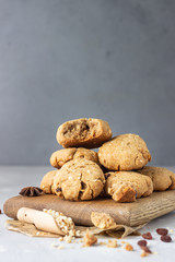Homemade vegan cookies with buckwheat, raisin and nuts. Healthy sweet snack. Light grey stone background