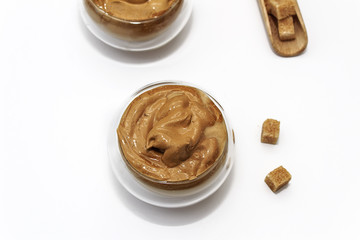 Dalgona coffee. Korean coffee in glasses cups on white bacground. Drink with milk, brown sugar and coffee.