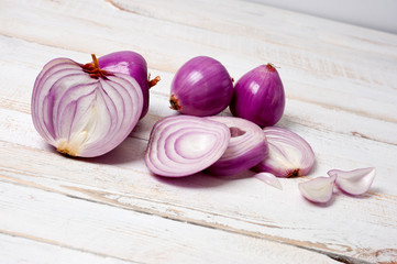 Red onion, lettuce. Health benefits, very rich in vitamins. Background for vegetables and garden plants and cooking.