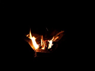Abstract, bonfire with flame in the dark.