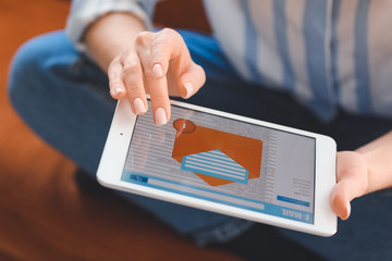Young woman with tablet computer checking her e-mail at home, closeup