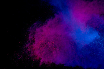 Fototapeta premium Colorful powder explosion on black background. Colorful dust explode. Paint Holi.