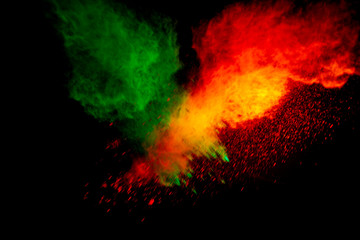 Colorful powder explosion on black background. Colorful dust explode. Paint Holi.