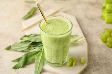 Glass of healthy smoothie on table