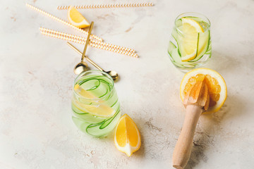 Glasses of healthy infused water on table