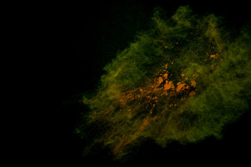 Fototapeta na wymiar Colorful powder explosion on black background. Colorful dust explode. Paint Holi.