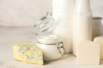 Different dairy products without lactose on light background