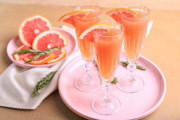 Glasses of tasty mimosa cocktails on table