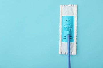 Floor mop on color background