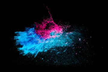 Colorful powder explosion on black background. Colorful dust explode. Paint Holi.