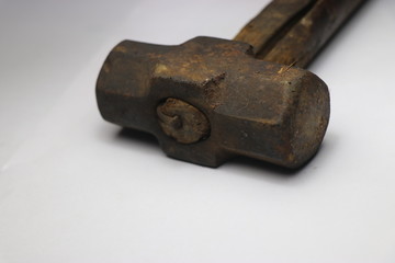 Old and antique hammer with wooden handle 