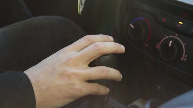 Close Up of Hand On Stick Shift While Driving Then Shifting to Fourth Gear
