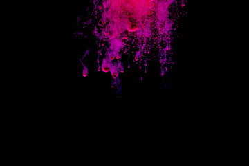 Colorful powder explosion on black background. Colorful dust explode. Paint Holi.