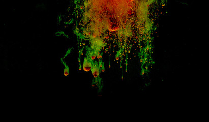 Colorful powder explosion on black background. Colorful dust explode. Paint Holi.