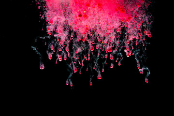 Abstract art powder paint on black background. Movement abstract frozen dust explosion multicolored on black background.