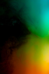 Obraz na płótnie Canvas Abstract art powder paint on black background. Movement abstract frozen dust explosion multicolored on black background.