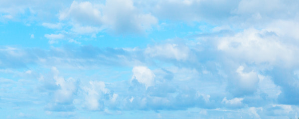 Blue sky with white cumulus clouds at daytime